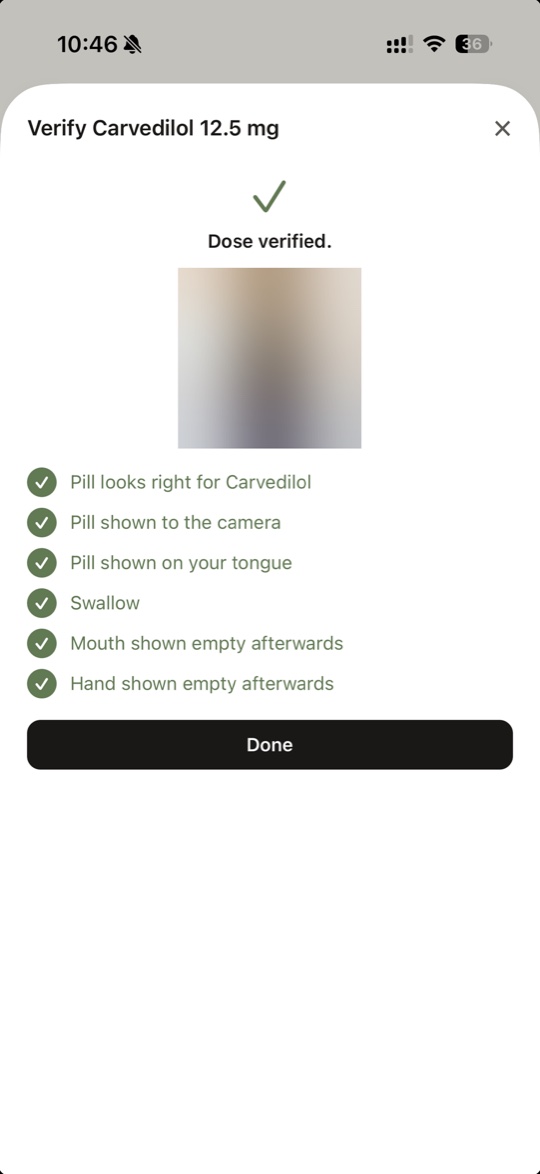 The result of recording a dose on iPhone: dose verified, with each of the checks listed and ticked, from the pill matching the medicine through to the hand shown empty afterwards.
